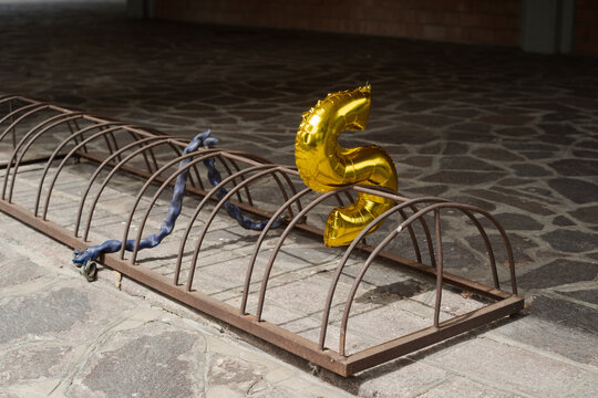 S letter stuck on a rack