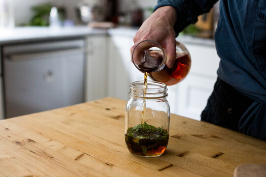 A woman makes an herbal tincture