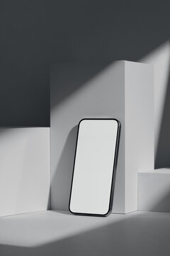 Smartphone with blank black screen on pedestal mockup space
