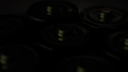 Close-up view of old used batteries, with selective focus. These batteries for recycling, promoting renewable energy initiatives. They include alkaline power sources.