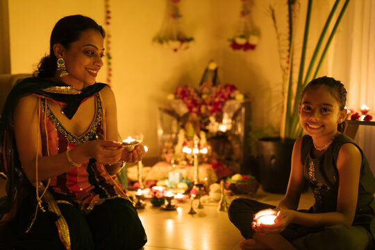 Mother and daughter at home for Diwali day