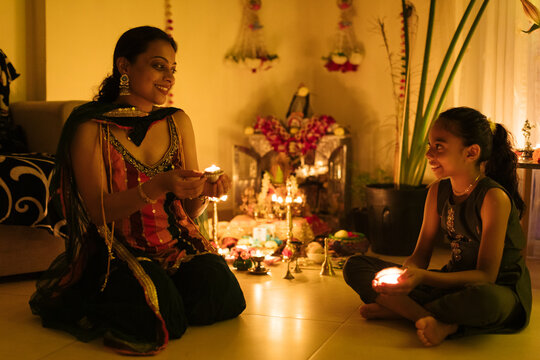 Mother and daughter at home for Diwali day