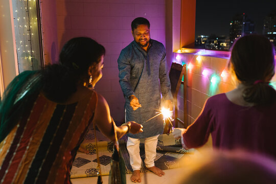 Friends celebrating Diwali with sparklers