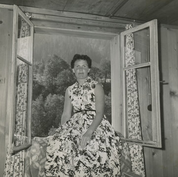 woman sitting in window