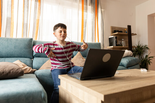 boy listening to music with headphones