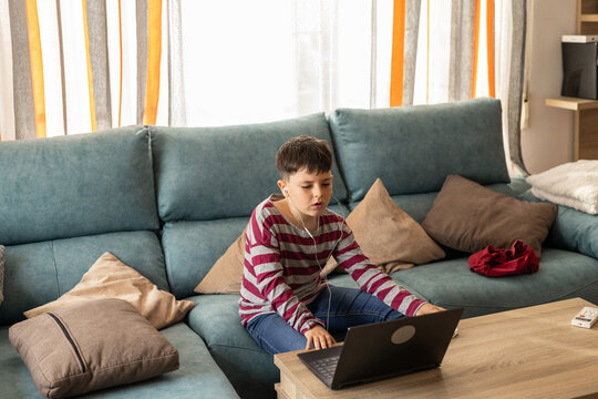 boy listening to music with headphones