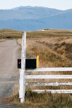 Black Rural Mailbox. The red lowered flag to show mail is not in.