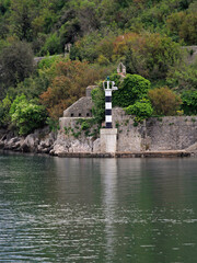 Black and White Lighthouse Pillar at Entrance to Boka Kotorska Bay in Montenegro
