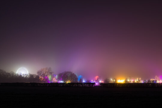 A fairground glowing on a winters night