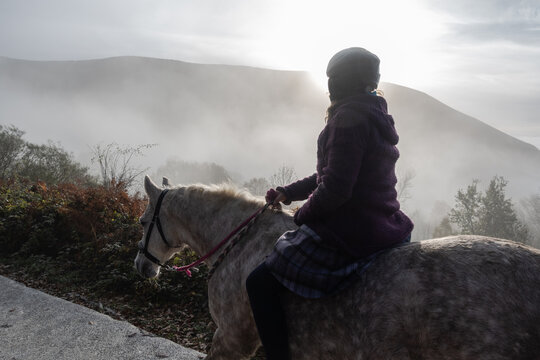 bareback horse riding in the mist