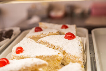 Cherry Topped Triangle Vanilla Cakes Retail Display