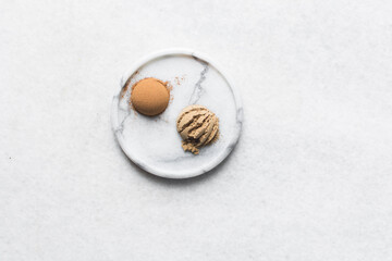 Teaspoon of cinnamon and allspice on a white tray, Saigon cinnamon, cinnamon powder on a marble tray