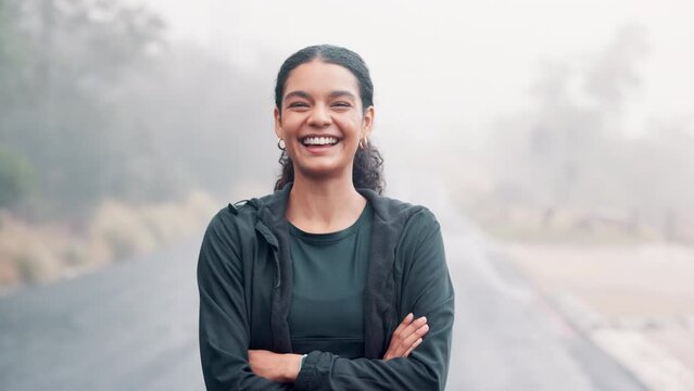 Woman, portrait and exercise outdoor with arms crossed for wellness, run or hiking with cardio in nature. Confident, smile with fitness and sports training for health, athlete and pride in workout