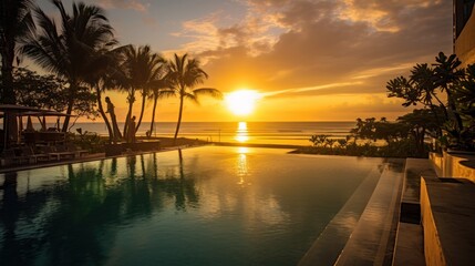 Fototapeta na wymiar Sunset at Kuta Beach Bali from swimming pool view