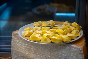 Italian food, fresh homemade stuffed pasta tortelli or ravioli dumplings ready to cook, Milan, Lombardy, Italy