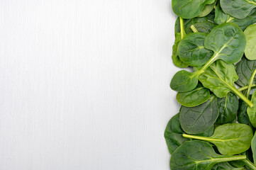 Fresh green baby Spinach leaves, diet and health concept, weight loss, spinach background top view copy space