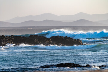 West coast of Fuerteventura island. Winter sea and sun vacation in El Cotillo touristic village, Canary islands, Spain. White sandy beach La Concha..