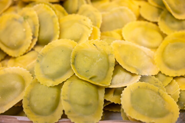 Italian food, fresh homemade stuffed pasta tortelli or ravioli dumplings ready to cook, Milan, Lombardy, Italy