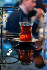 Turkish sweet tea served in traditional glass in restaurant in Istanbul, Turkey