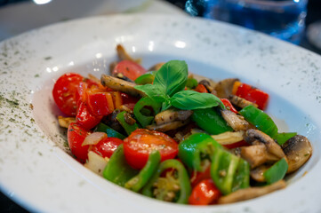 Vegetarian dishes, mezze in Turkish restaurant, grilles mushrooms, pepper and fresh vegetables salad