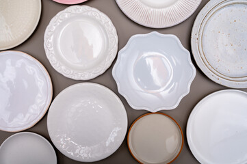 Variety of ceramic or porcelain trendy plates flat lay copy space