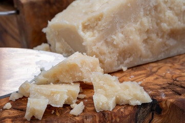 Traditional italian food - 22 months aged in caves Italian parmesan hard cheese from Parmigiano-Reggiano, Italy