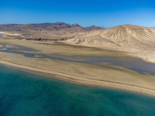 Aerial view on sandy dunes and turquoise water of Sotavento beach, Costa Calma, Fuerteventura, Canary islands, Spain in winter