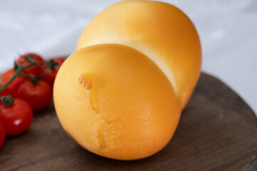 Cheese collection, Italian cheese scamorza, caciocavallo, provolone made from cow milk in South Italy yellow smoked cheese