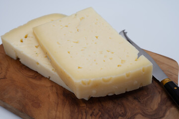 Fresh Asiago cow's milk cheese, from Asiago in Italy, used in panini or sandwiches or melted on variety of dishes, classified as a Swiss-type Alpine cheese