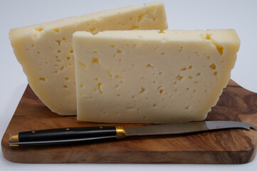 Fresh Asiago cow's milk cheese, from Asiago in Italy, used in panini or sandwiches or melted on variety of dishes, classified as a Swiss-type Alpine cheese