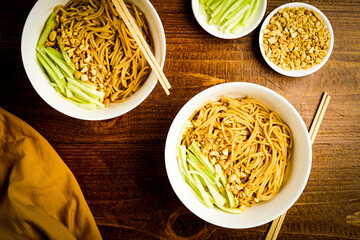 Sesame noodles with chopped peanuts and fresh cucumbers