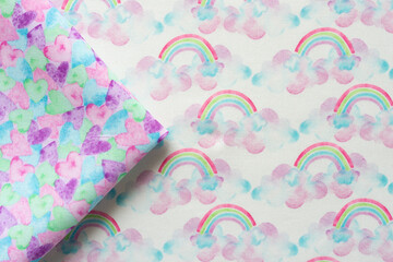 triangle folded fabric piece with hearts on fabric with clouds and rainbows print pattern