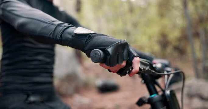 Hands, gloves and prepare with bike in nature for fitness, adventure or outdoor for travel by trees. Person, cycling and ready with safety, transport and extreme sport in competition, race or contest