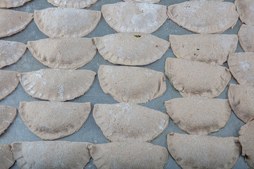 Leek pastry made from buckwheat flour. Homemade savory hand pies. Pastry with special vegetable...