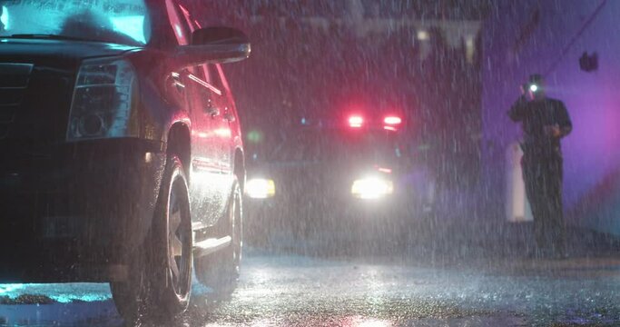 Mysterious Police Officer Pulls Over Vehicle at Night in the Rain. Heavy Rain. Shines Flashlight at vehicle.