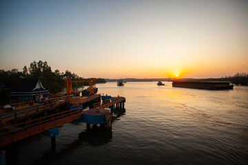 The atmosphere of Balikpapan's Kariangau Harbor at dusk. Kariangau Harbor is one of the...