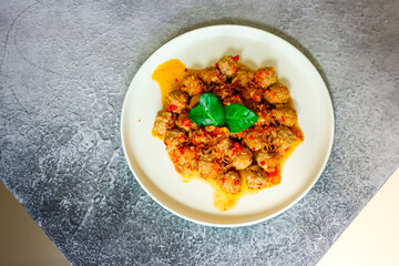 Sambal Goreng Kreni, an Indonesian dish. Meatballs cooked with spicy sauce