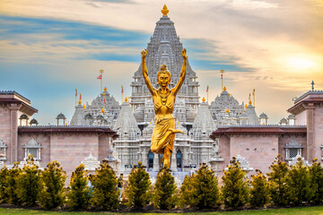 Statue of Nilkanth Varni with Akshardham Mahamandir temple in the back - Powered by Adobe