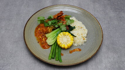 Seafood, rice, fresh vegetables, shrimp sauce, boiled corn, Indonesian food