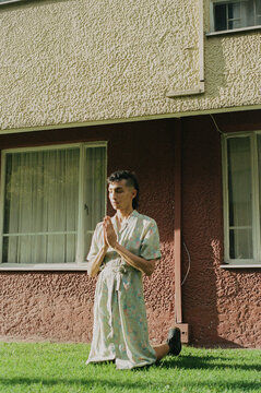 man praying with a dress