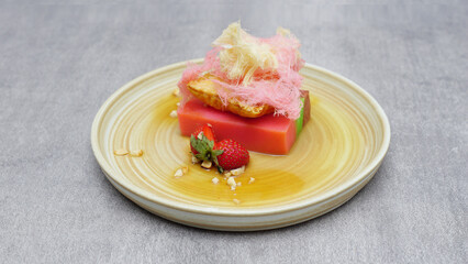 Strawberry pudding with nene hair sprinkles, a typical Indonesian food