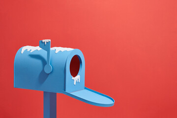 Open a blue letter box isolated on red in snow