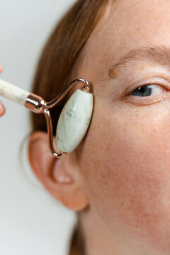 A woman does a facial massage