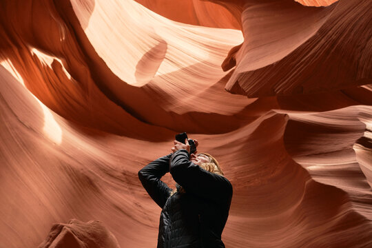 Photographer exploring Antelope Canyon