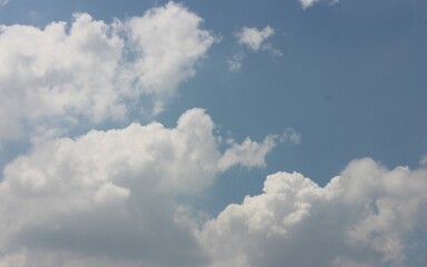 blue sky background with tiny clouds.