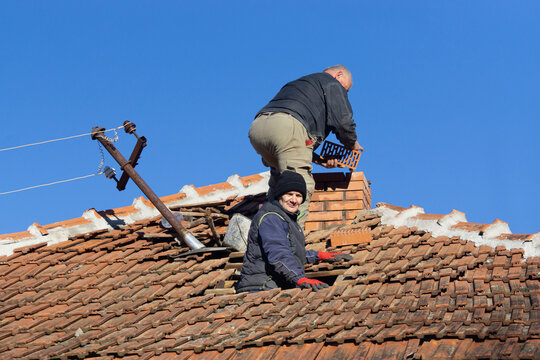 Man and woman Build a chimney
