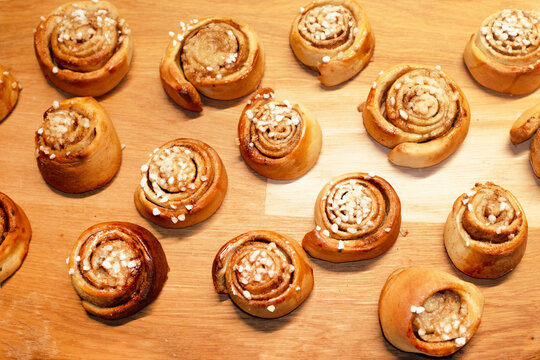 Freshly baked delicious sweet pastry cinnamon buns with direct flash