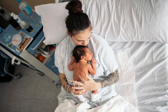 Mother Sleeping With Her Baby In The Hospital