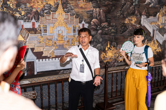 Thai man giving a tour.