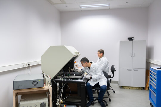 Scientists Working With Atomic Force Microscope.